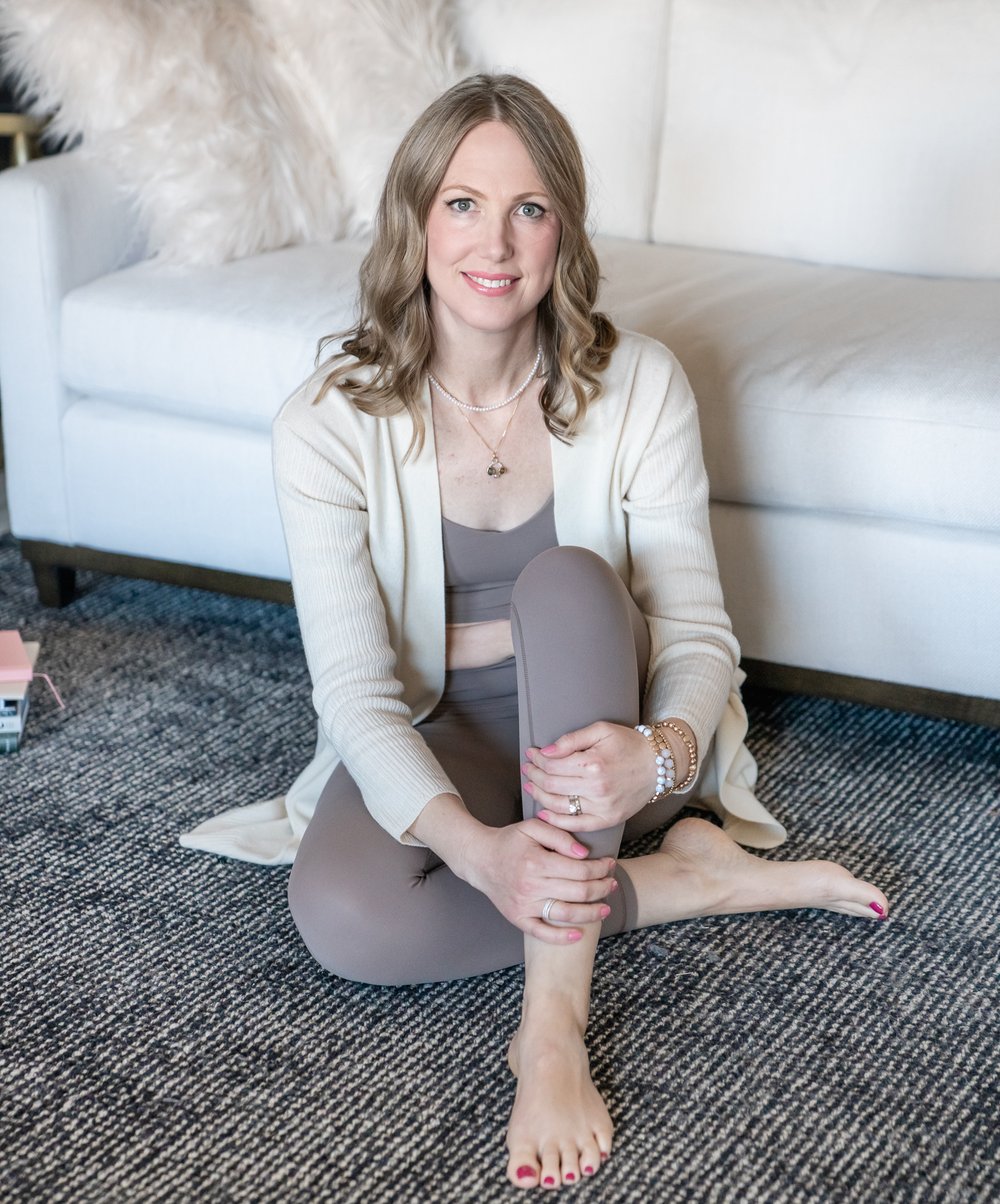 Tabitha Green sitting on the floor, smiling