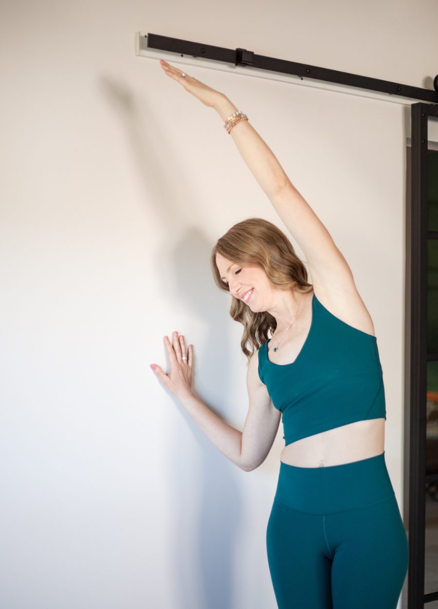 Tabitha in a gentle standing side stretch