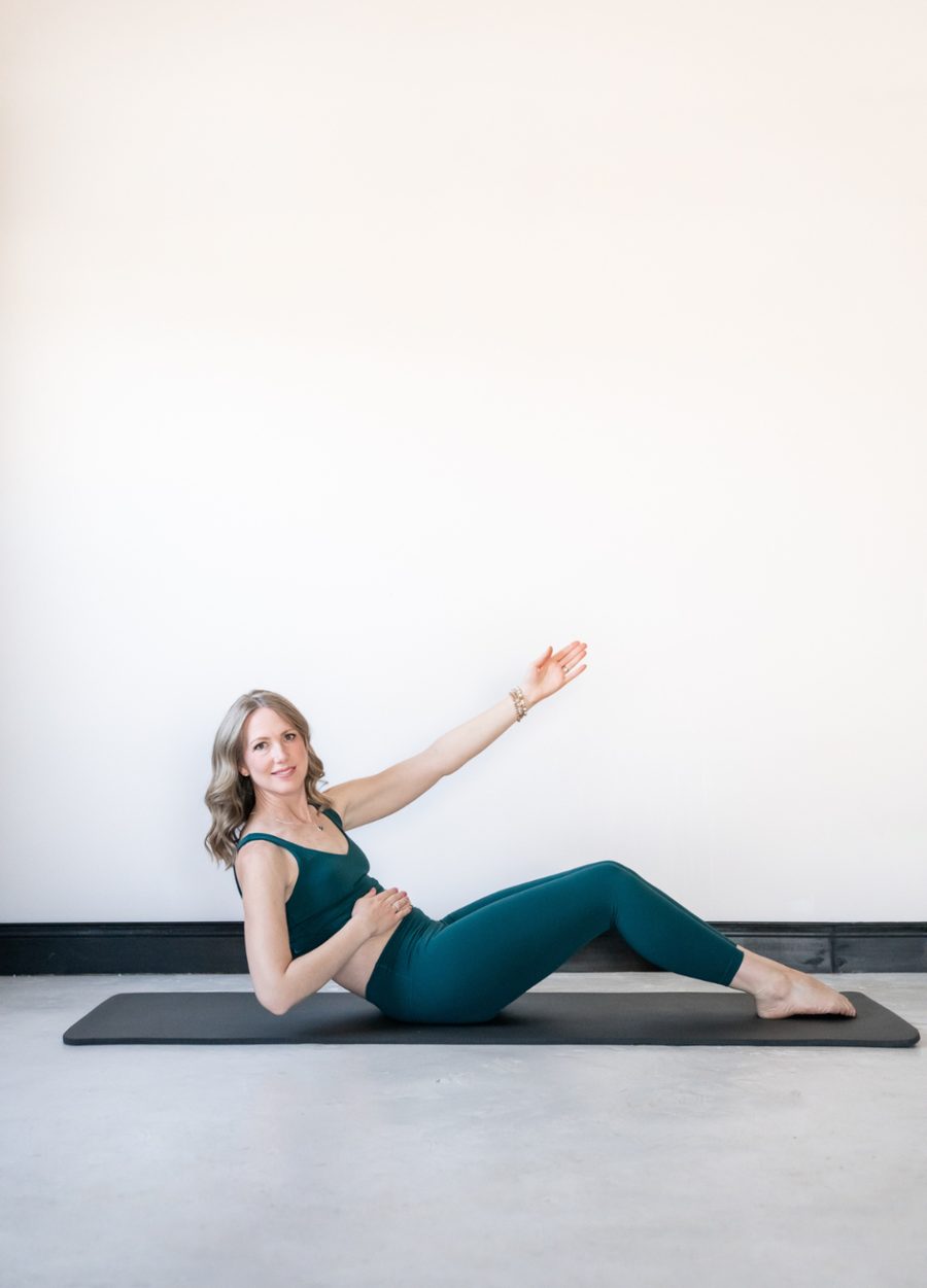 Tabitha demonstrating a gentle Pilates exercise on a mat